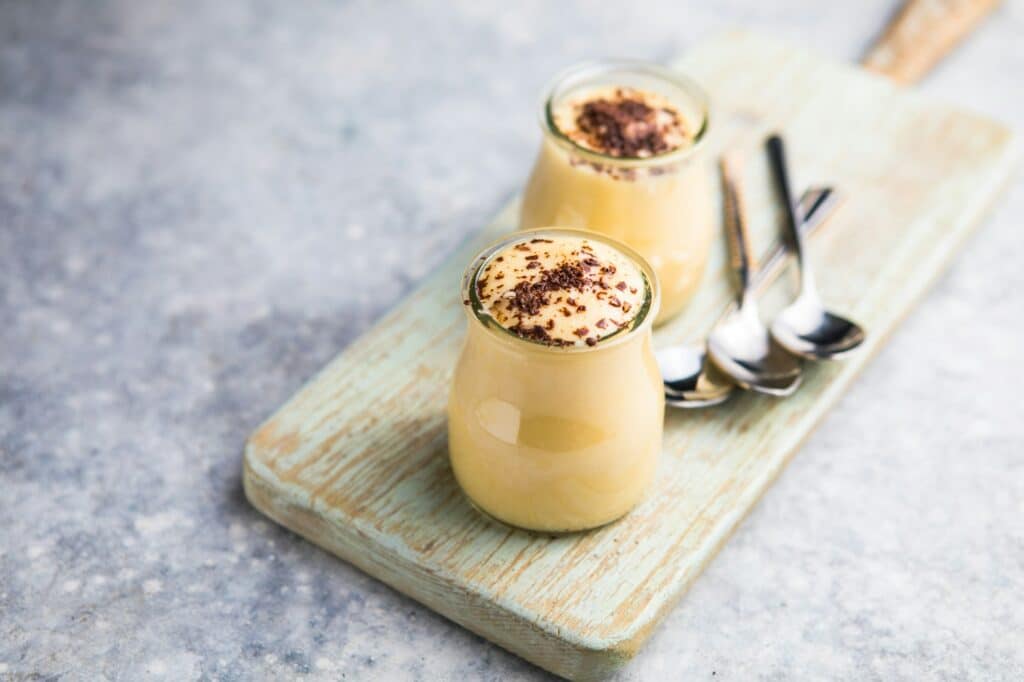 Custard cream in glasses with chocolate